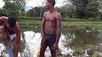 Two brown twinks show their oral skills outdoors Thumbnail