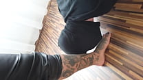 Tattooed lady plays with her foot