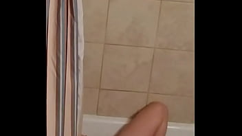 Spying on MILF enjoying a dildo in the bath.