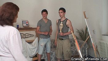 Naughty granny takes two young dicks