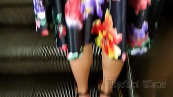Forced upskirt at brunette in black g-string