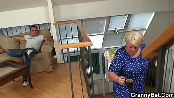 Young guy fucks busty blonde granny from behind