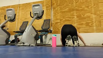 Asian in black leggings at gym