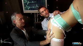 Horny nurse Katie Weale enjoys fucking with two guys at once