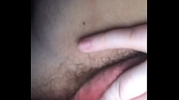 Three fingers stuffed deep in hairy pussy.