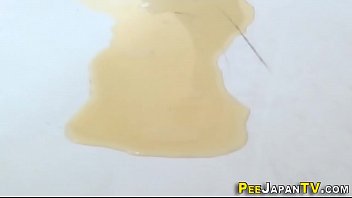 Japanese babe pees puddle