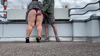 Spanking a sexy MILF's gorgeous fat ass while she jerks off my cock on the top of the parking lot