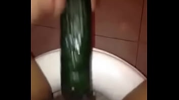 girl masturbathing with cucumber