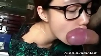 Hot brunette Asian sucks cock