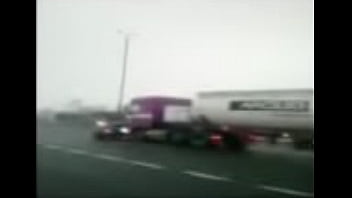 Semi Pushes Car Down Freeway