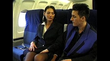 Image for porn video Brunette beauty wearing stewardess uniform gets fucked on a plane at Xvideos